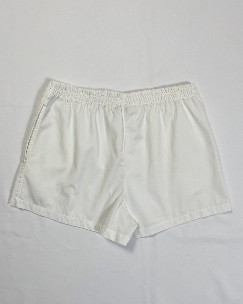 White Fila Tennis Shorts - Detailed View